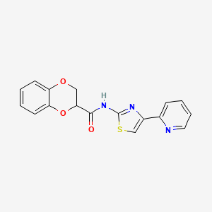 molecular formula C17H13N3O3S B2698888 N-(4-pyridin-2-yl-1,3-thiazol-2-yl)-2,3-dihydro-1,4-benzodioxine-3-carboxamide 