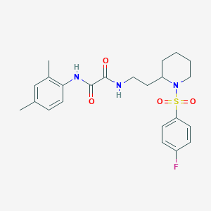 molecular formula C23H28FN3O4S B2699671 N'-(2,4-dimethylphenyl)-N-{2-[1-(4-fluorobenzenesulfonyl)piperidin-2-yl]ethyl}ethanediamide CAS No. 898450-17-4