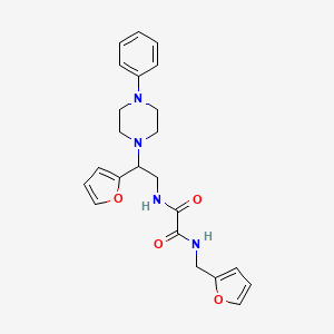 molecular formula C23H26N4O4 B2700355 N'-[2-(furan-2-yl)-2-(4-phenylpiperazin-1-yl)ethyl]-N-[(furan-2-yl)methyl]ethanediamide CAS No. 877631-75-9