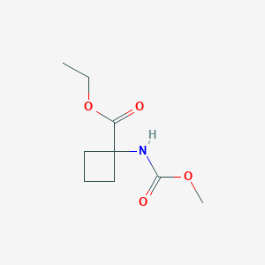 molecular formula C9H15NO4 B027007 Cyclobutanecarboxylic acid, 1-[(methoxycarbonyl)amino]-, ethyl ester (9CI) CAS No. 106366-63-6