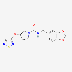 molecular formula C15H16N4O4S B2701948 N-[(2H-1,3-benzodioxol-5-yl)methyl]-3-(1,2,5-thiadiazol-3-yloxy)pyrrolidine-1-carboxamide CAS No. 2320535-80-4