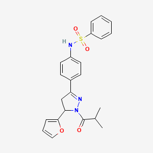 molecular formula C23H23N3O4S B2702492 N-{4-[5-(furan-2-yl)-1-(2-methylpropanoyl)-4,5-dihydro-1H-pyrazol-3-yl]phenyl}benzenesulfonamide CAS No. 923216-21-1