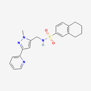molecular formula C20H22N4O2S B2709442 N-{[1-methyl-3-(pyridin-2-yl)-1H-pyrazol-5-yl]methyl}-5,6,7,8-tetrahydronaphthalene-2-sulfonamide CAS No. 2309311-19-9