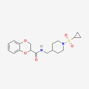 molecular formula C18H24N2O5S B2710857 N-{[1-(cyclopropanesulfonyl)piperidin-4-yl]methyl}-2,3-dihydro-1,4-benzodioxine-2-carboxamide CAS No. 1235266-67-7