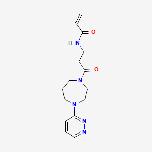 B2711821 N-[3-Oxo-3-(4-pyridazin-3-yl-1,4-diazepan-1-yl)propyl]prop-2-enamide CAS No. 2201816-27-3