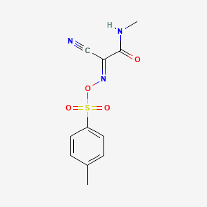 molecular formula C11H11N3O4S B2713432 [(E)-[1-Cyano-2-(methylamino)-2-oxoethylidene]amino] 4-methylbenzenesulfonate CAS No. 2321343-46-6