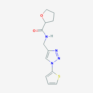 molecular formula C12H14N4O2S B2715544 N-((1-(thiophen-2-yl)-1H-1,2,3-triazol-4-yl)methyl)tetrahydrofuran-2-carboxamide CAS No. 2034381-70-7