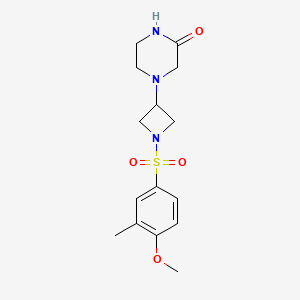 molecular formula C15H21N3O4S B2717164 4-[1-(4-Methoxy-3-methylphenyl)sulfonylazetidin-3-yl]piperazin-2-one CAS No. 2415565-76-1