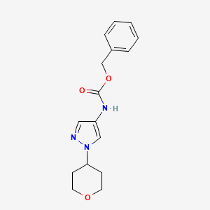 molecular formula C16H19N3O3 B2719047 benzyl (1-(tetrahydro-2H-pyran-4-yl)-1H-pyrazol-4-yl)carbamate CAS No. 1705156-84-8