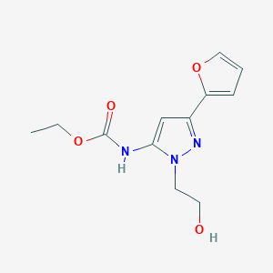 molecular formula C12H15N3O4 B2732129 ethyl (3-(furan-2-yl)-1-(2-hydroxyethyl)-1H-pyrazol-5-yl)carbamate CAS No. 1219904-49-0