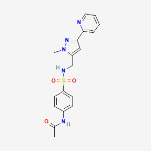 molecular formula C18H19N5O3S B2734277 N-[4-[(2-Methyl-5-pyridin-2-ylpyrazol-3-yl)methylsulfamoyl]phenyl]acetamide CAS No. 2309586-69-2