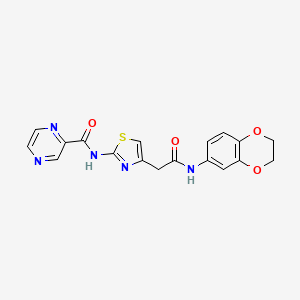 molecular formula C18H15N5O4S B2736602 N-(4-(2-((2,3-dihydrobenzo[b][1,4]dioxin-6-yl)amino)-2-oxoethyl)thiazol-2-yl)pyrazine-2-carboxamide CAS No. 1206987-15-6