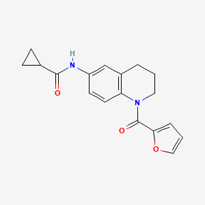 molecular formula C18H18N2O3 B2741982 N-[1-(furan-2-carbonyl)-1,2,3,4-tetrahydroquinolin-6-yl]cyclopropanecarboxamide CAS No. 942005-67-6