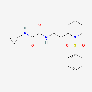 molecular formula C18H25N3O4S B2747599 N'-{2-[1-(benzenesulfonyl)piperidin-2-yl]ethyl}-N-cyclopropylethanediamide CAS No. 898444-80-9