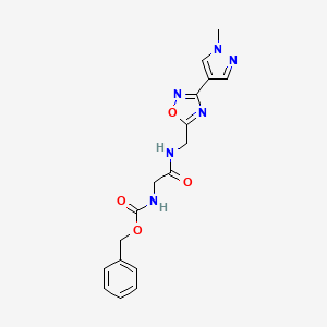 molecular formula C17H18N6O4 B2752557 benzyl (2-(((3-(1-methyl-1H-pyrazol-4-yl)-1,2,4-oxadiazol-5-yl)methyl)amino)-2-oxoethyl)carbamate CAS No. 2034384-90-0