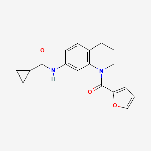 molecular formula C18H18N2O3 B2757558 N-[1-(furan-2-carbonyl)-1,2,3,4-tetrahydroquinolin-7-yl]cyclopropanecarboxamide CAS No. 946265-40-3