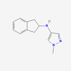 molecular formula C13H15N3 B2758703 N-(2,3-dihydro-1H-inden-2-yl)-1-methyl-1H-pyrazol-4-amine CAS No. 1153973-24-0