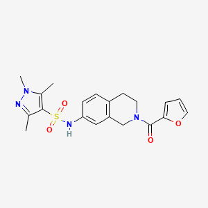 N-(2-(furan-2-carbonyl)-1,2,3,4-tetrahydroisoquinolin-7-yl)-1,3,5-trimethyl-1H-pyrazole-4-sulfonamide