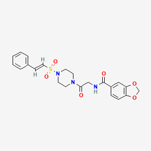 molecular formula C22H23N3O6S B2771243 N-[2-oxo-2-[4-[(E)-2-phenylethenyl]sulfonylpiperazin-1-yl]ethyl]-1,3-benzodioxole-5-carboxamide CAS No. 878457-68-2