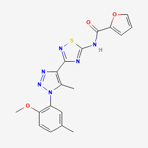molecular formula C18H16N6O3S B2771783 N-{3-[1-(2-methoxy-5-methylphenyl)-5-methyl-1H-1,2,3-triazol-4-yl]-1,2,4-thiadiazol-5-yl}furan-2-carboxamide CAS No. 931364-35-1