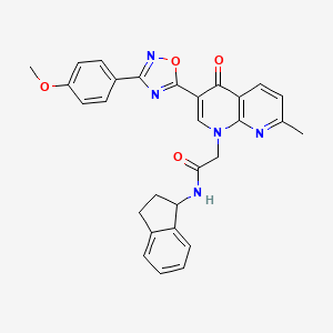 N-(2,3-dihydro-1H-inden-1-yl)-2-{3-[3-(4-methoxyphenyl)-1,2,4-oxadiazol-5-yl]-7-methyl-4-oxo-1,4-dihydro-1,8-naphthyridin-1-yl}acetamide