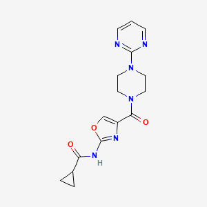molecular formula C16H18N6O3 B2779292 N-(4-(4-(pyrimidin-2-yl)piperazine-1-carbonyl)oxazol-2-yl)cyclopropanecarboxamide CAS No. 1351645-06-1