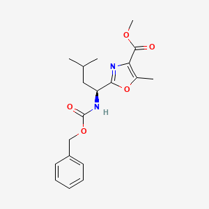 molecular formula C19H24N2O5 B2787264 methyl 2-((1S)-1-(((benzyloxy)carbonyl)amino)-3-methylbutyl)-5-methyl-1,3-oxazole-4-carboxylate CAS No. 1881275-68-8