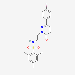 molecular formula C21H22FN3O3S B2799943 N-{2-[3-(4-fluorophenyl)-6-oxo-1,6-dihydropyridazin-1-yl]ethyl}-2,4,6-trimethylbenzene-1-sulfonamide CAS No. 921552-19-4