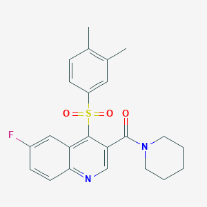 molecular formula C23H23FN2O3S B2799961 4-(3,4-DIMETHYLBENZENESULFONYL)-6-FLUORO-3-(PIPERIDINE-1-CARBONYL)QUINOLINE CAS No. 1111050-60-2