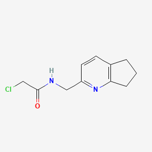 molecular formula C11H13ClN2O B2800485 2-Chloro-N-(6,7-dihydro-5H-cyclopenta[b]pyridin-2-ylmethyl)acetamide CAS No. 2411245-41-3