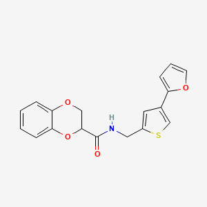 N-[[4-(Furan-2-yl)thiophen-2-yl]methyl]-2,3-dihydro-1,4-benzodioxine-3-carboxamide