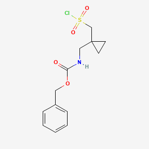 molecular formula C13H16ClNO4S B2801466 Benzyl N-({1-[(chlorosulfonyl)methyl]cyclopropyl}methyl)carbamate CAS No. 1780518-29-7