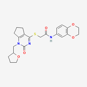 molecular formula C22H25N3O5S B2802373 N-(2,3-dihydro-1,4-benzodioxin-6-yl)-2-({2-oxo-1-[(oxolan-2-yl)methyl]-1H,2H,5H,6H,7H-cyclopenta[d]pyrimidin-4-yl}sulfanyl)acetamide CAS No. 899756-22-0