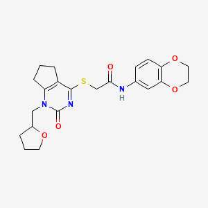 N-(2,3-dihydrobenzo[b][1,4]dioxin-6-yl)-2-((2-oxo-1-((tetrahydrofuran-2-yl)methyl)-2,5,6,7-tetrahydro-1H-cyclopenta[d]pyrimidin-4-yl)thio)acetamide