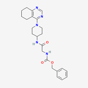 molecular formula C23H29N5O3 B2806089 Benzyl (2-oxo-2-((1-(5,6,7,8-tetrahydroquinazolin-4-yl)piperidin-4-yl)amino)ethyl)carbamate CAS No. 2034257-83-3