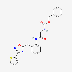 Benzyl (2-oxo-2-((2-((3-(thiophen-2-yl)-1,2,4-oxadiazol-5-yl)methyl)phenyl)amino)ethyl)carbamate