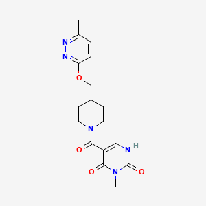 B2814127 3-Methyl-5-[4-[(6-methylpyridazin-3-yl)oxymethyl]piperidine-1-carbonyl]-1H-pyrimidine-2,4-dione CAS No. 2379978-66-0