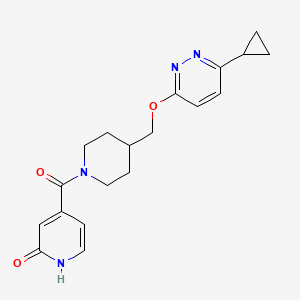 B2814440 4-[4-[(6-Cyclopropylpyridazin-3-yl)oxymethyl]piperidine-1-carbonyl]-1H-pyridin-2-one CAS No. 2379994-67-7