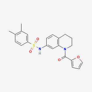 molecular formula C22H22N2O4S B2816695 N-[1-(furan-2-carbonyl)-1,2,3,4-tetrahydroquinolin-7-yl]-3,4-dimethylbenzene-1-sulfonamide CAS No. 946321-85-3
