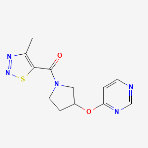 molecular formula C12H13N5O2S B2821362 4-{[1-(4-methyl-1,2,3-thiadiazole-5-carbonyl)pyrrolidin-3-yl]oxy}pyrimidine CAS No. 2034580-63-5