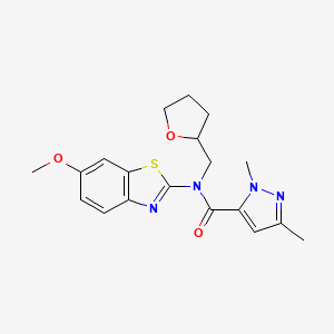molecular formula C19H22N4O3S B2823921 N-(6-methoxy-1,3-benzothiazol-2-yl)-1,3-dimethyl-N-[(oxolan-2-yl)methyl]-1H-pyrazole-5-carboxamide CAS No. 1013796-81-0