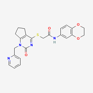 molecular formula C23H22N4O4S B2833259 N-(2,3-dihydro-1,4-benzodioxin-6-yl)-2-({2-oxo-1-[(pyridin-2-yl)methyl]-1H,2H,5H,6H,7H-cyclopenta[d]pyrimidin-4-yl}sulfanyl)acetamide CAS No. 899955-07-8