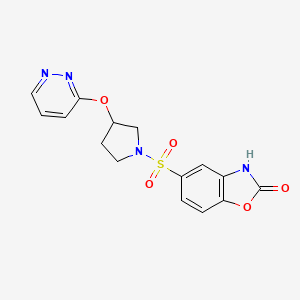 molecular formula C15H14N4O5S B2834309 5-((3-(pyridazin-3-yloxy)pyrrolidin-1-yl)sulfonyl)benzo[d]oxazol-2(3H)-one CAS No. 2034501-57-8