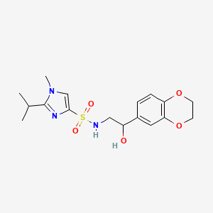 molecular formula C17H23N3O5S B2837308 N-(2-(2,3-dihydrobenzo[b][1,4]dioxin-6-yl)-2-hydroxyethyl)-2-isopropyl-1-methyl-1H-imidazole-4-sulfonamide CAS No. 2034570-73-3