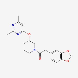 2-(Benzo[d][1,3]dioxol-5-yl)-1-(3-((2,6-dimethylpyrimidin-4-yl)oxy)piperidin-1-yl)ethanone
