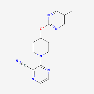 molecular formula C15H16N6O B2848593 3-{4-[(5-Methylpyrimidin-2-yl)oxy]piperidin-1-yl}pyrazine-2-carbonitrile CAS No. 2380034-39-7