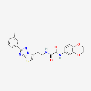 molecular formula C23H21N5O4S B2850963 N1-(2,3-dihydrobenzo[b][1,4]dioxin-6-yl)-N2-(2-(2-(m-tolyl)thiazolo[3,2-b][1,2,4]triazol-6-yl)ethyl)oxalamide CAS No. 894040-90-5