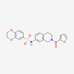 molecular formula C22H20N2O6S B2852411 N-(2-(furan-2-carbonyl)-1,2,3,4-tetrahydroisoquinolin-7-yl)-2,3-dihydrobenzo[b][1,4]dioxine-6-sulfonamide CAS No. 955698-09-6