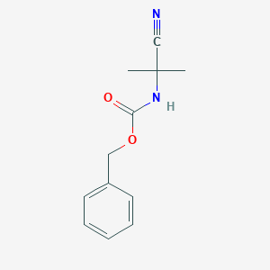 molecular formula C12H14N2O2 B028547 苄基(1-氰基-1-甲基乙基)氨基甲酸酯 CAS No. 100134-82-5