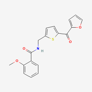 B2857231 N-((5-(furan-2-carbonyl)thiophen-2-yl)methyl)-2-methoxybenzamide CAS No. 1797613-18-3